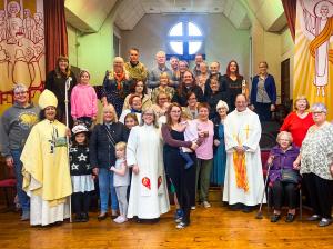Holy nativity congregation with Mike and Bishop Smitha.jpg